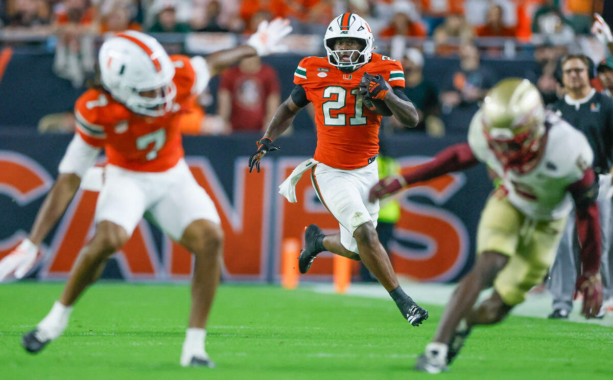 Miami Hurricanes running back Javian Mallory (21) on a carry in the second half against the Florida State Seminoles at Hard Rock Stadium in Miami Gardens, Florida, on Saturday, October 17, 2026.